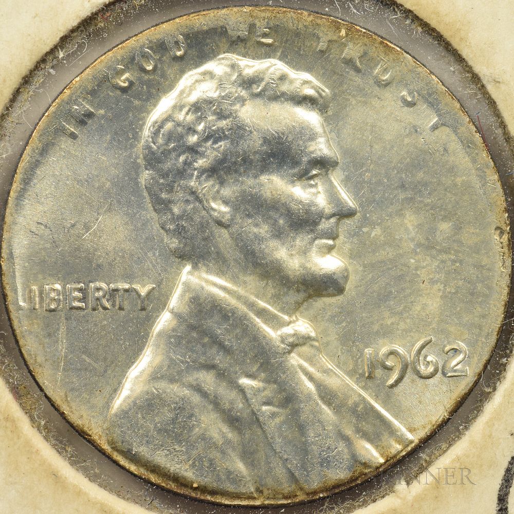 1962 penny struck on silver dime planchet next to regular 1962 penny showing size difference and silver color