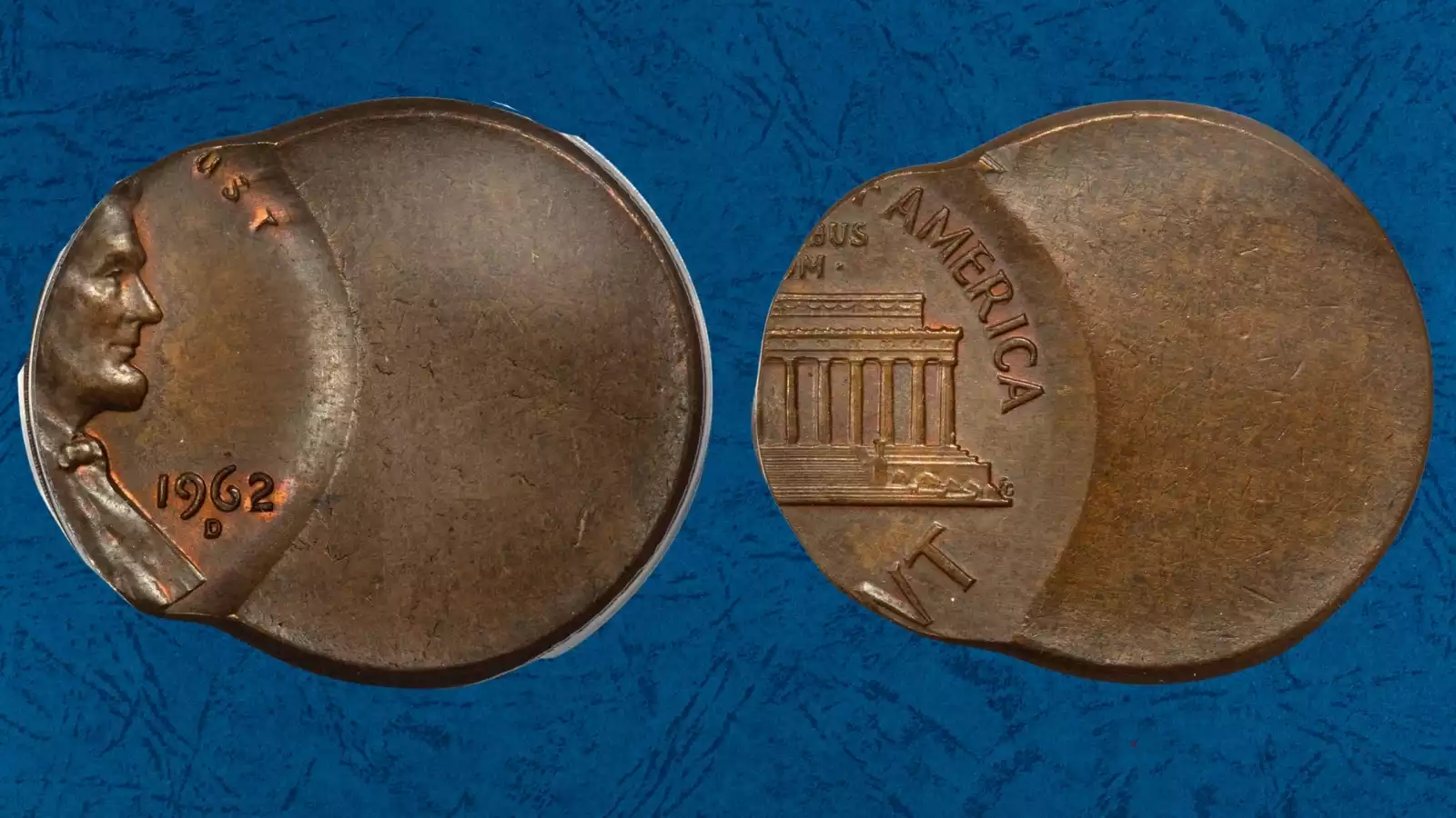 1962 penny with off-center strike showing blank crescent of unstruck copper alongside Lincoln portrait